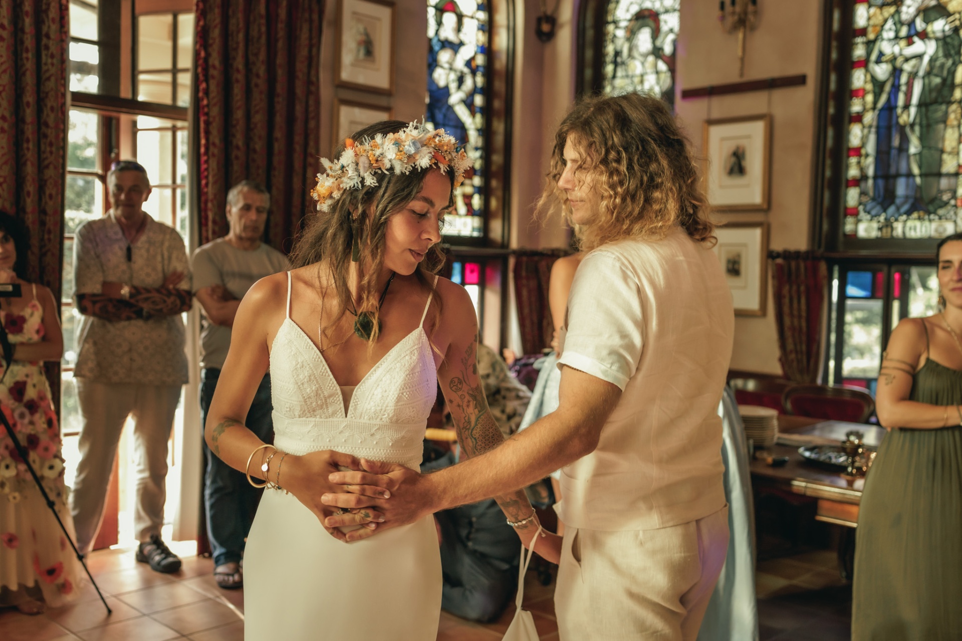 A couple sharing a first dance under warm string lights at a hinterland wedding